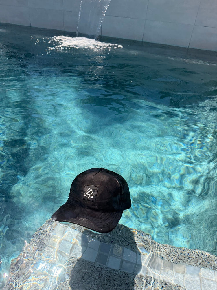 Peak On Top hat floating in pool